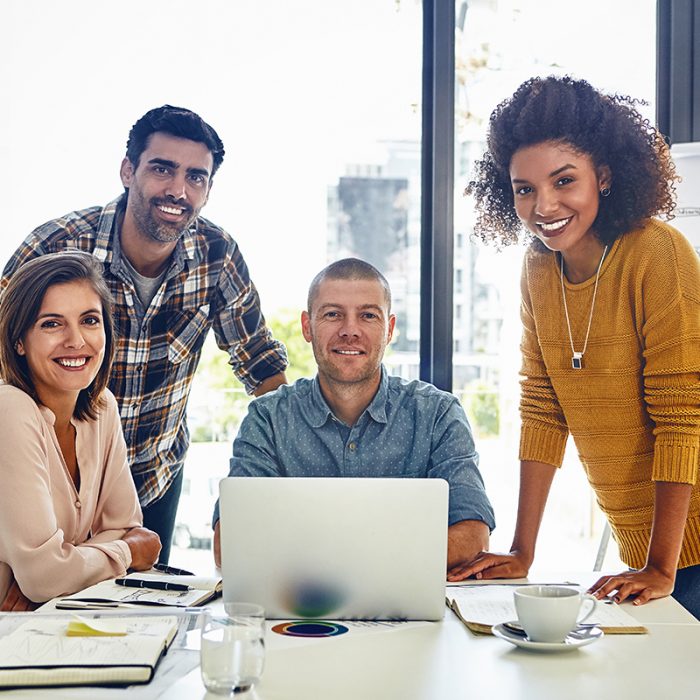 Portrait of a team of designers having a meeting in an office